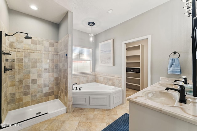 bathroom featuring vanity and separate shower and tub