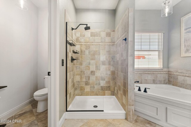 bathroom with separate shower and tub and toilet