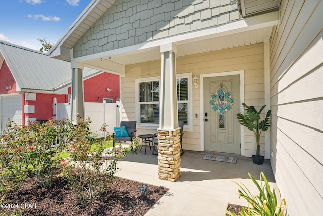 entrance to property featuring covered porch