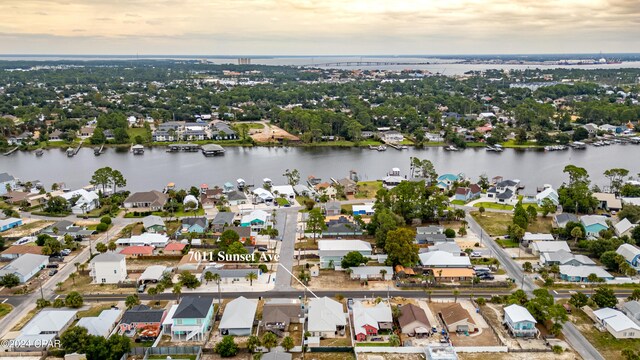 aerial view at dusk with a water view