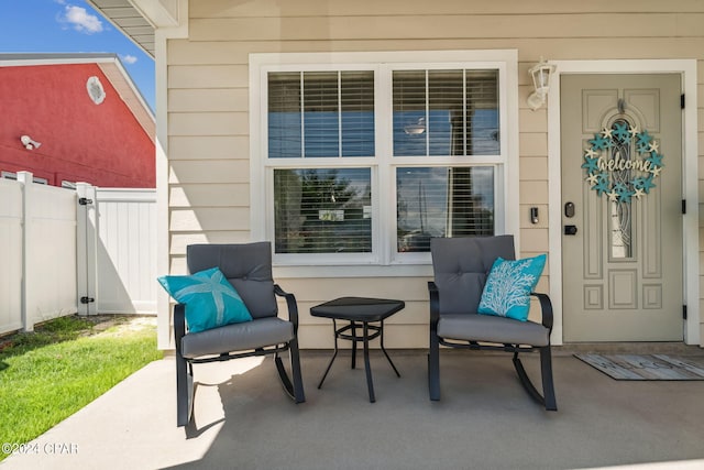 property entrance featuring a patio area