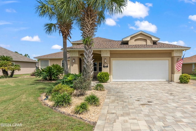 view of front facade featuring a garage and a front yard