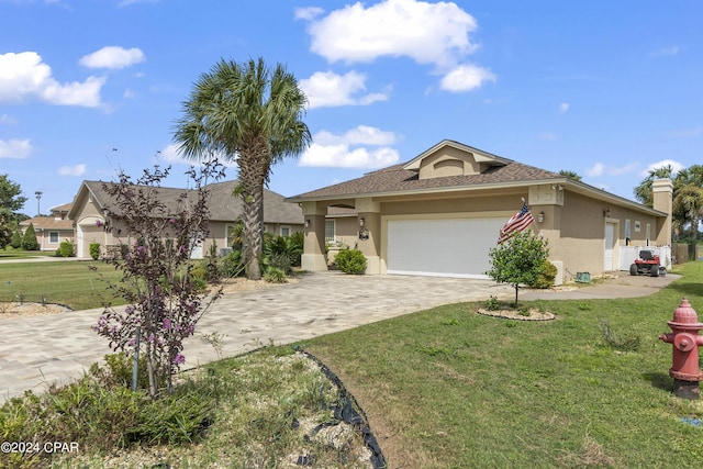 view of front of home with a garage, a front lawn, decorative driveway, and stucco siding