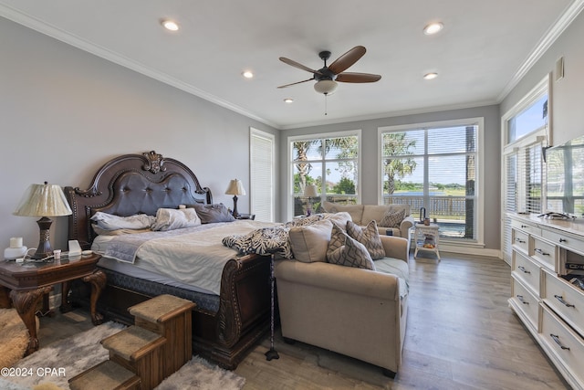 bedroom featuring crown molding, recessed lighting, ceiling fan, wood finished floors, and baseboards