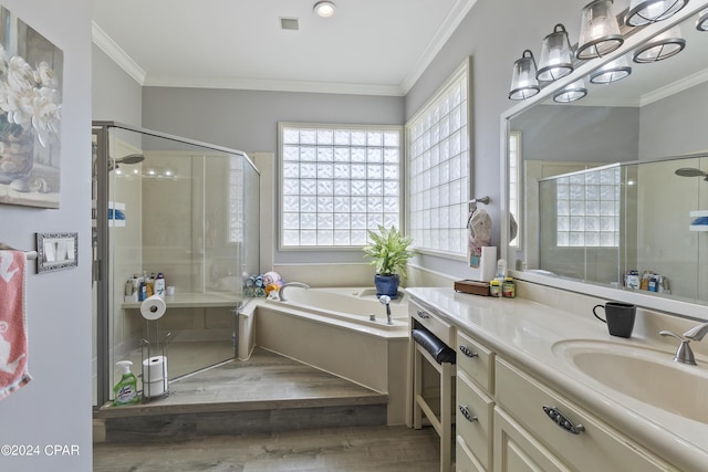 full bath featuring a garden tub, visible vents, vanity, a stall shower, and crown molding