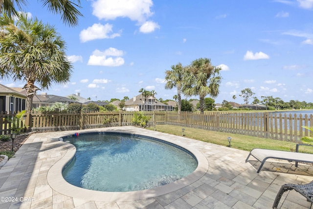 view of swimming pool featuring a patio area and a fenced backyard