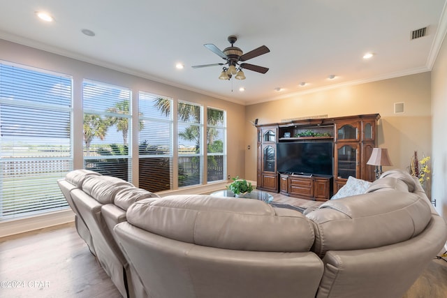 living room featuring ceiling fan, light hardwood / wood-style floors, and ornamental molding