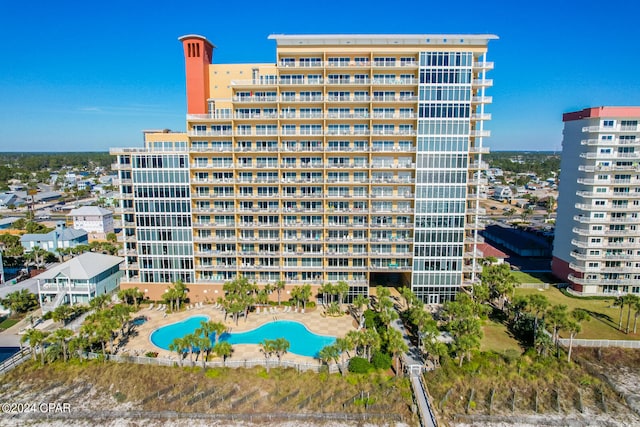 view of property featuring a community pool