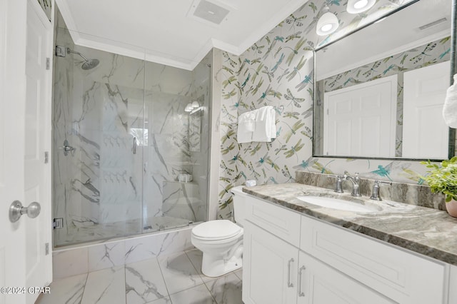 bathroom with crown molding, vanity, toilet, and a shower with door