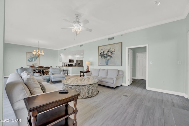 living room with ceiling fan with notable chandelier, crown molding, and light hardwood / wood-style flooring