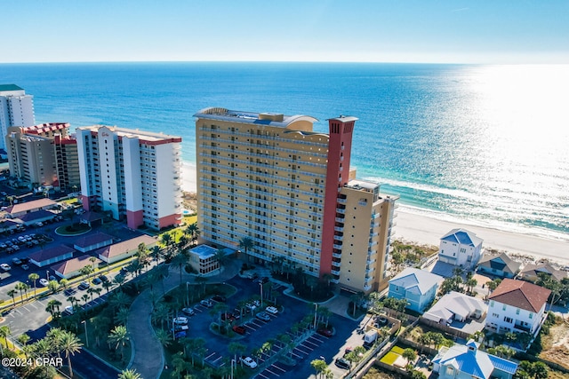 aerial view with a water view and a view of the beach