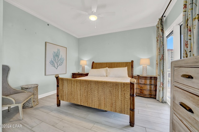 bedroom featuring crown molding, light hardwood / wood-style flooring, and ceiling fan