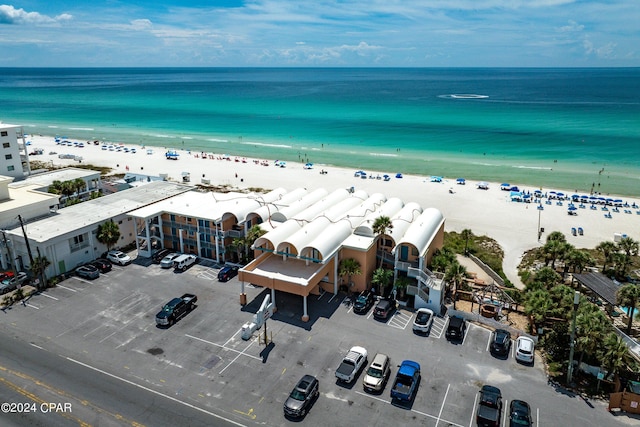 bird's eye view featuring a view of the beach and a water view