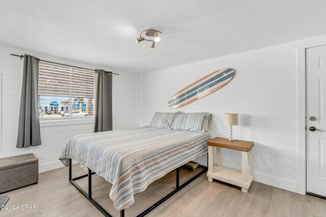 bedroom with light hardwood / wood-style flooring