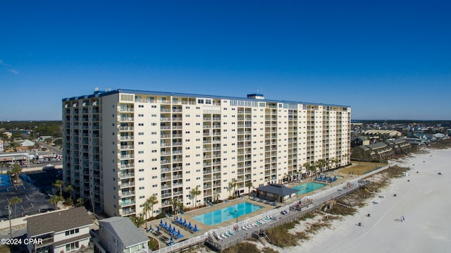 view of property with a beach view