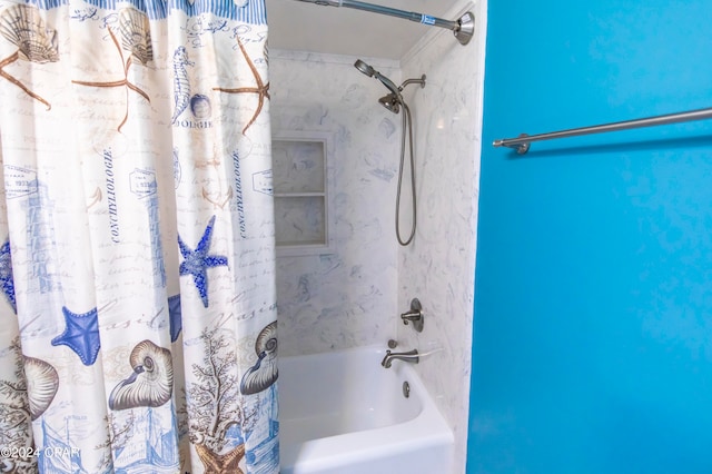 bathroom featuring shower / tub combo with curtain