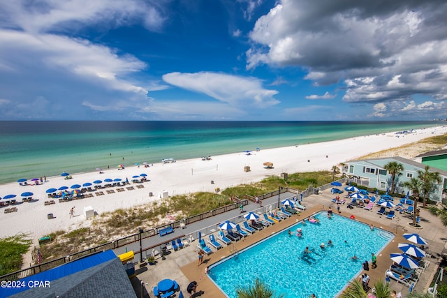 drone / aerial view featuring a view of the beach and a water view