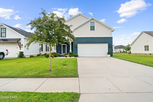 view of front of property with a garage and a front yard