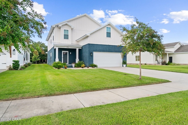 view of front of house with a garage and a front lawn