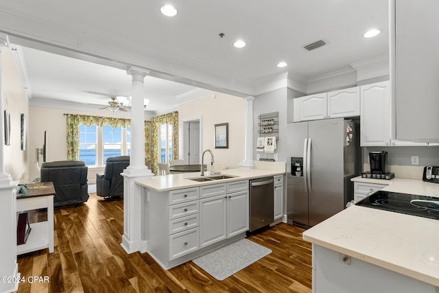 kitchen with ceiling fan, sink, white cabinetry, stainless steel appliances, and dark hardwood / wood-style flooring