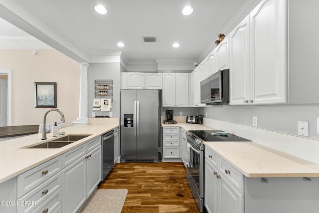 kitchen with white cabinets, sink, stainless steel appliances, dark hardwood / wood-style floors, and crown molding