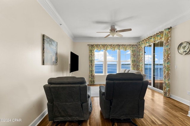 living room featuring ceiling fan, crown molding, and hardwood / wood-style floors