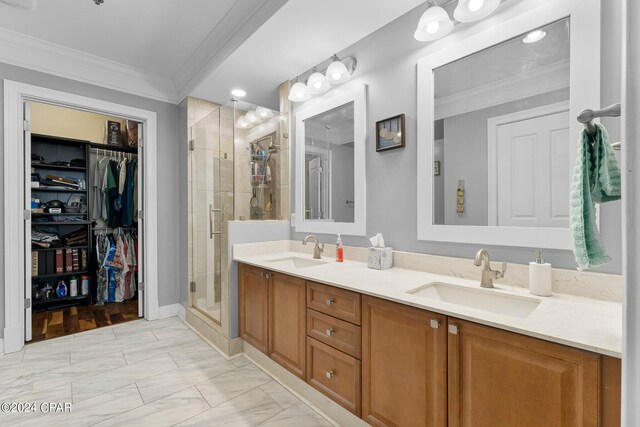 bathroom featuring wood-type flooring, walk in shower, vanity, and crown molding