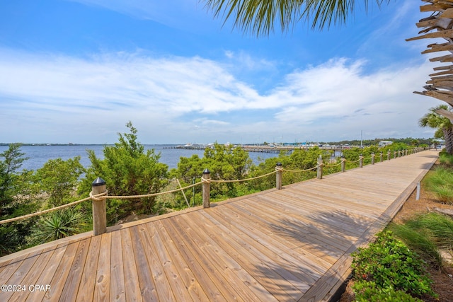 wooden deck featuring a water view