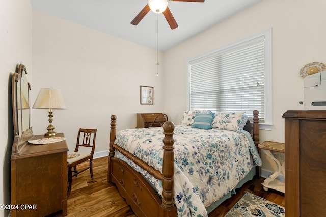 bedroom with wood-type flooring and ceiling fan