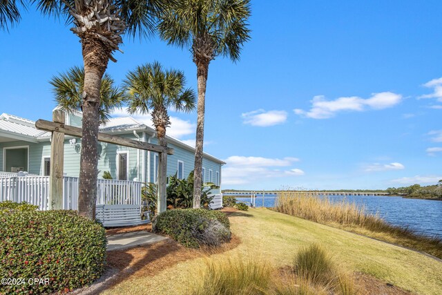 23223 Front Beach Rd Unit Ph-06, Panama City Beach, FL 32413 - view of grassy yard featuring a water view