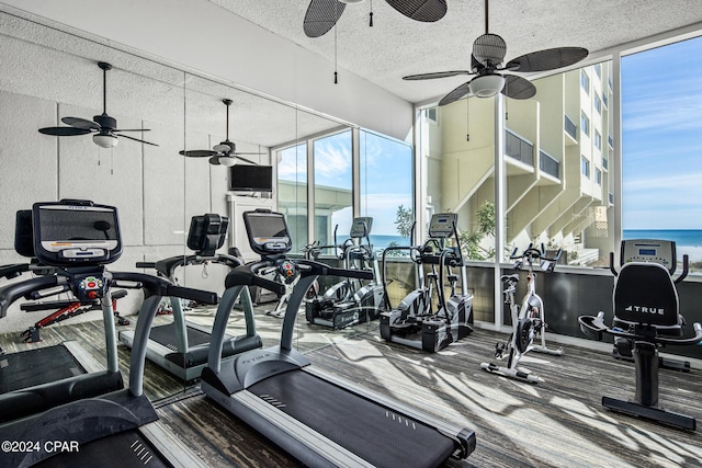 23223 Front Beach Rd Unit Ph-06, Panama City Beach, FL 32413 - exercise room with ceiling fan, a textured ceiling, and carpet flooring