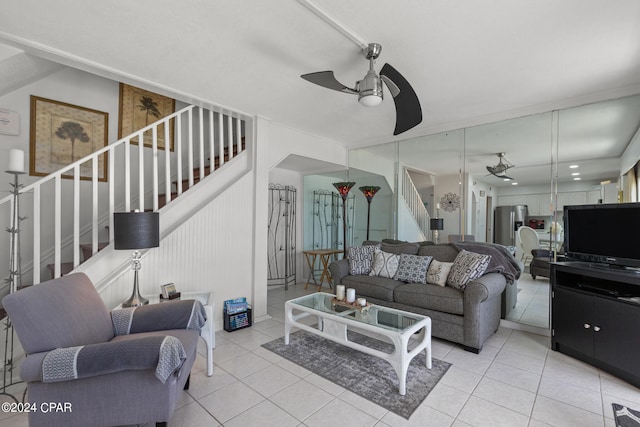 tiled living room with ceiling fan