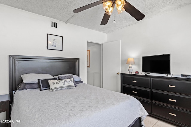 23223 Front Beach Rd Unit Ph-06, Panama City Beach, FL 32413 - bedroom featuring a textured ceiling, light tile patterned flooring, and ceiling fan