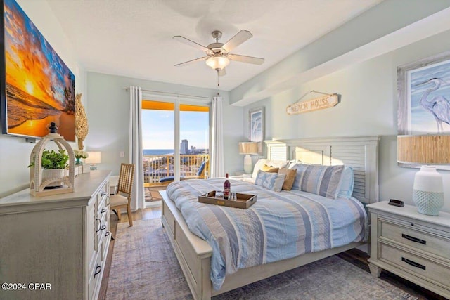 bedroom featuring dark wood-type flooring, ceiling fan, and access to outside