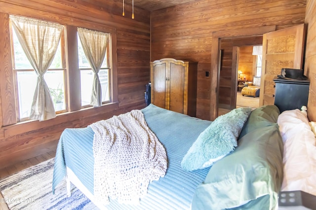 bedroom with wooden walls