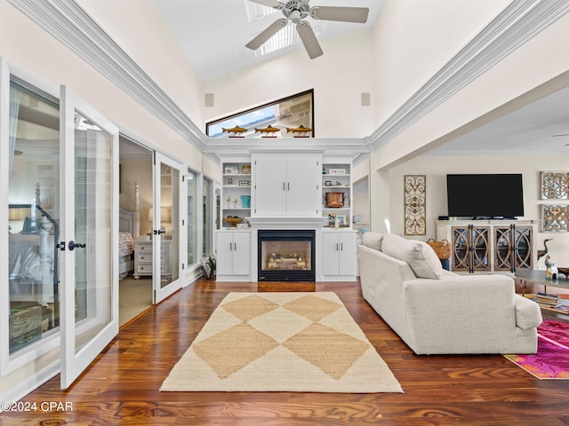 living room featuring high vaulted ceiling, ceiling fan, dark hardwood / wood-style flooring, and french doors