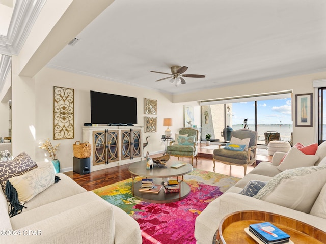 living room with ceiling fan, hardwood / wood-style flooring, and crown molding