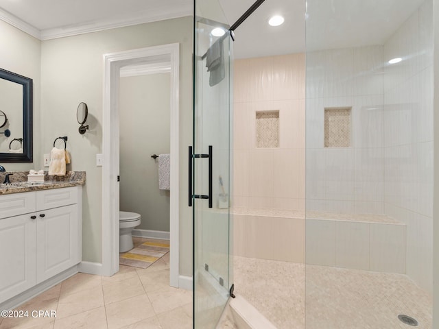 bathroom featuring tile patterned flooring, walk in shower, toilet, vanity, and ornamental molding