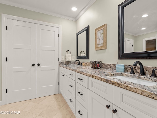 bathroom featuring crown molding, vanity, and tile patterned flooring