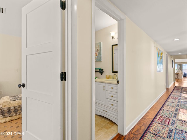 hallway featuring sink