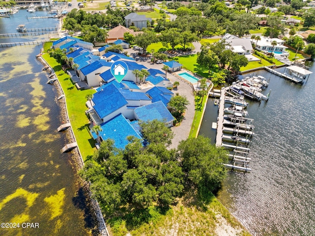 birds eye view of property with a water view