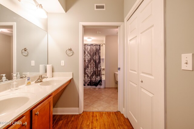 bathroom with walk in shower and toilet