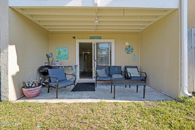 doorway to property featuring a patio