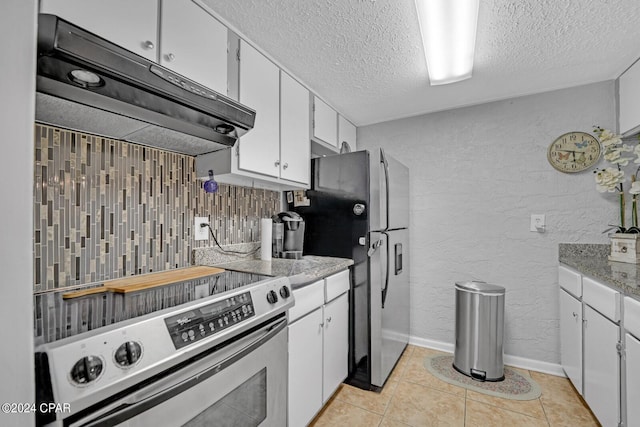 kitchen with decorative backsplash, a textured ceiling, electric range oven, light tile patterned flooring, and white cabinetry