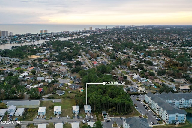 aerial view at dusk with a water view