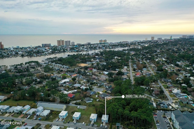 aerial view at dusk with a water view