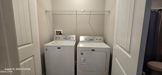 washroom featuring separate washer and dryer