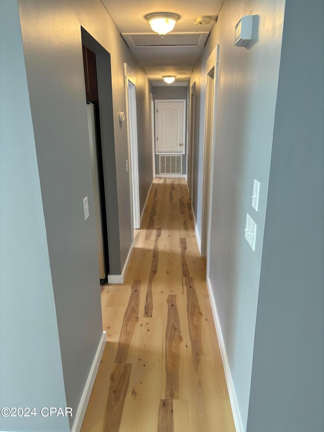 hallway featuring light hardwood / wood-style floors