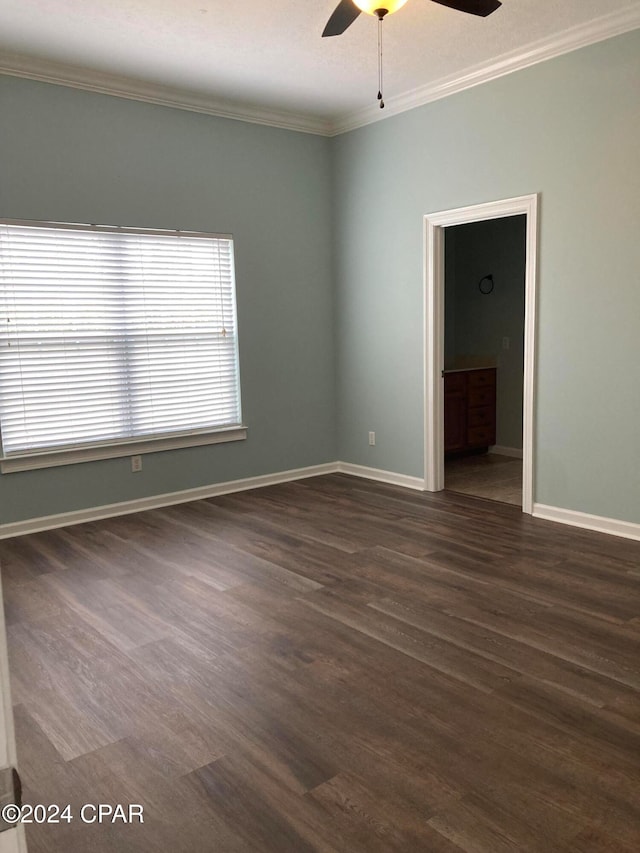 spare room featuring ceiling fan, crown molding, and dark hardwood / wood-style flooring