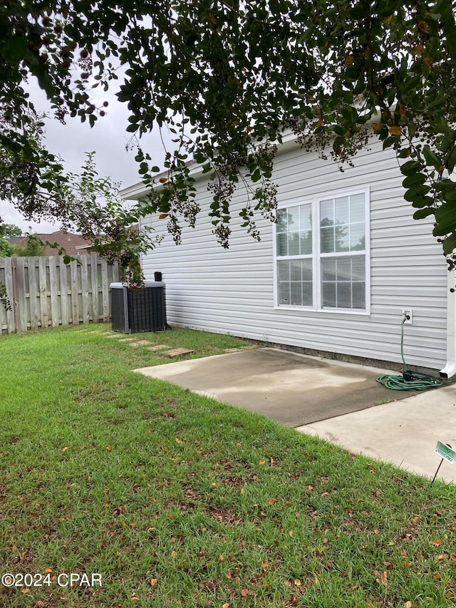 view of yard featuring a patio and cooling unit